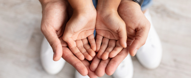 Parent holding hands with child during a child custody and visitation appointment