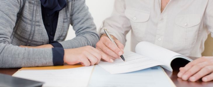 Woman looking over prenuptial agreement