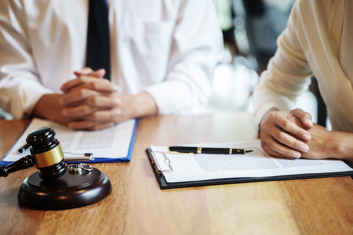 Divorcing couple sitting in an office