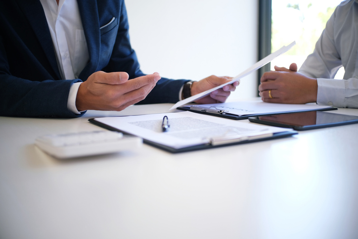 Woman sitting with divorce attorney