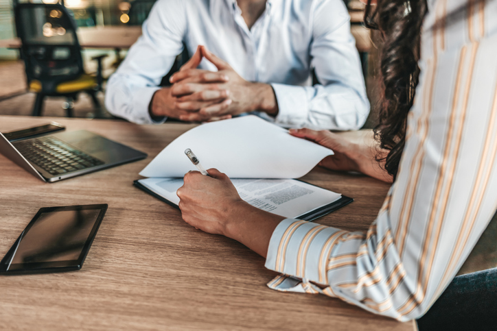Woman sitting with divorce attorney
