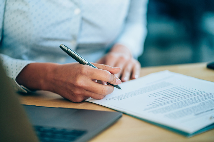 Woman signing divorce documents