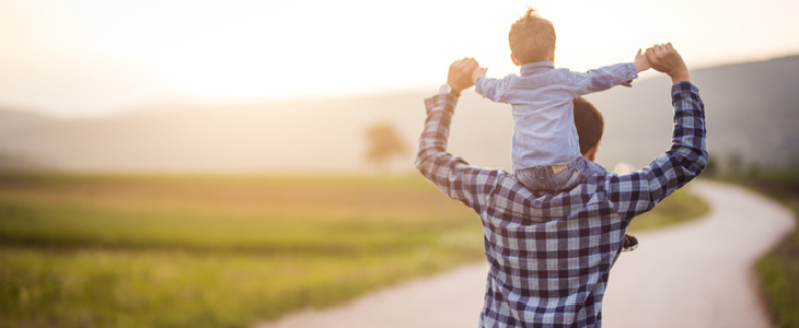 Father spending time with his young son in the park